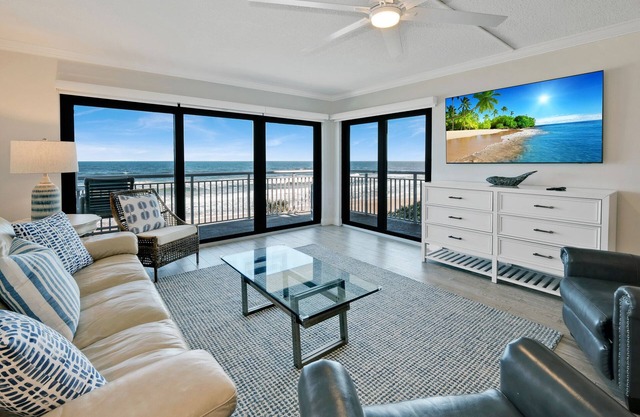 Updated direct oceanfront condo with a balcony, beachfront heated pool and beach access