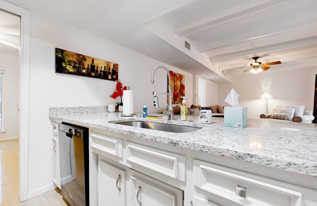 Updated home with a large enclosed yard, al fresco dining, bright interior, & AC