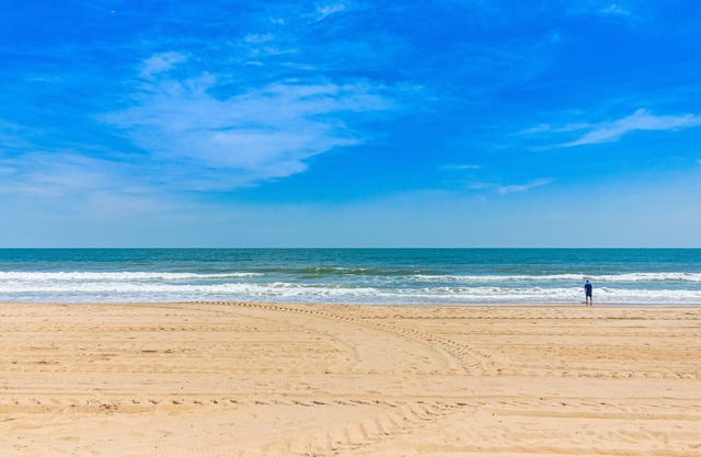 Updated ocean-view condo with beach access, patio, central AC & washer/dryer