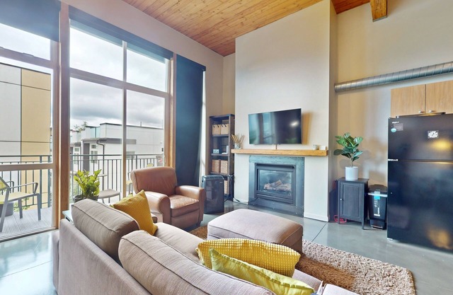 Upscale condo with reserved parking, balcony, & sleek kitchen - walk to parks