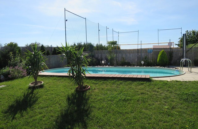Vacation apartment with pool, beach volleyball court, barbecue area