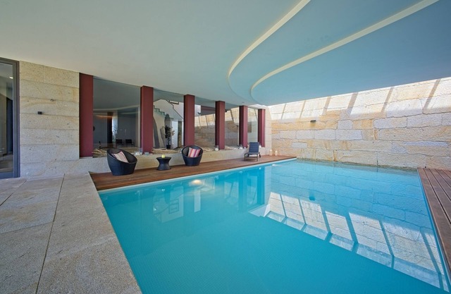 Vacation home with indoor pool and sea view!