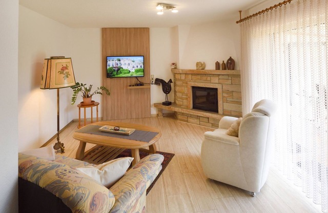Vacation home with garden, terrace and fireplace