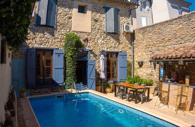 VERY NICE STONE TOWN HOUSE WITH HEATED POOL