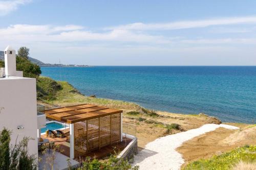 Villa Akroyiali - Seafront Serenity with Shared Pool