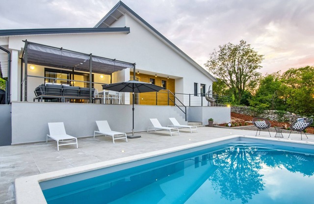Villa Bellavu for 8 people with playground & sea view in Rakalj