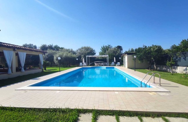 Villa with private pool surrounded by greenery