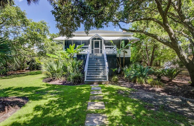 Vintage island cottage 1 block from beach with fenced yard, porch, & W/D
