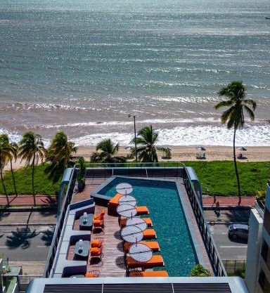 Viva hospedagens - Flat 009 beira mar com Varanda e piscina aquecida