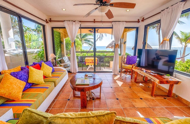 Walk onto the white sandy beach of Half Moon Bay from your patio door!