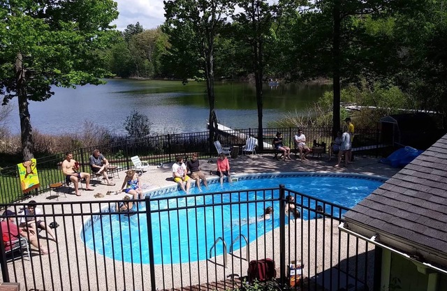 Waterfront home in Lake Ann with outdoor pool. Pet ok, row boat, kayak, canoe