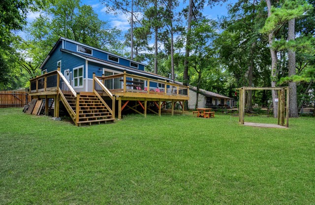 Waterfront house with a large deck and dock for boat or fishing
