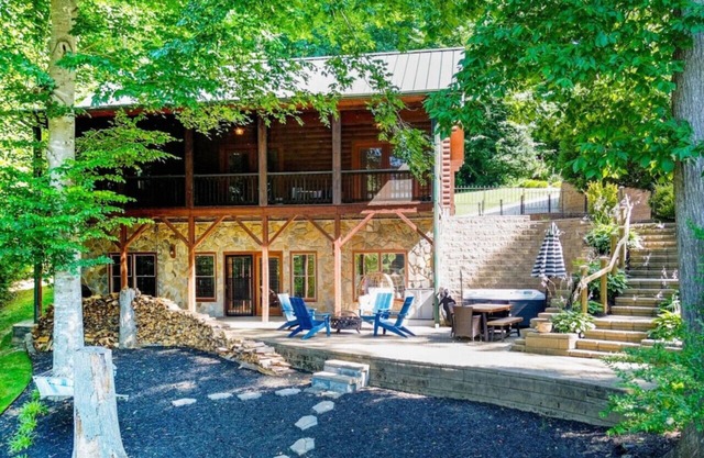 Waterfront Log Cabin w/Hot Tub, Kayaks, Firepit, King Beds, & Pet-Friendly