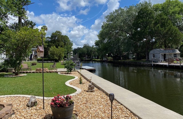 Waterfront Paradise w dock, large patio, lanai, pool, hot tub! Bring your boat!