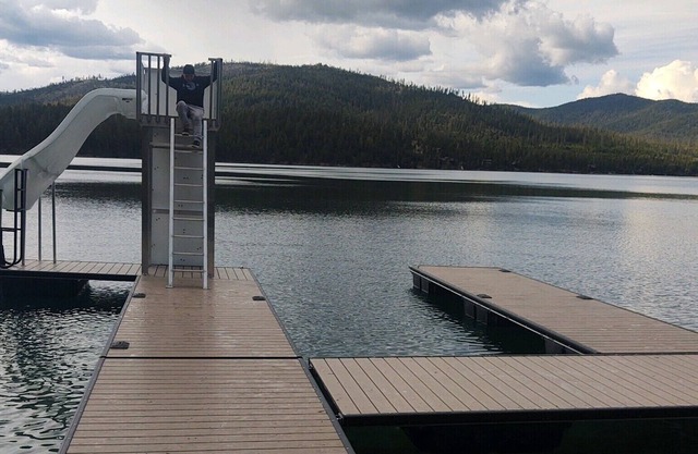 Waterfront w/ Water Slide, Rock Climbing Wall & Ice Fishing Shanty in Winter