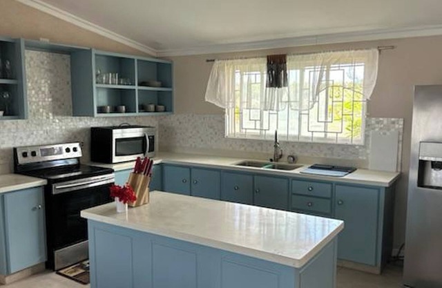 Welcome to Hope Winds, a charming 2,500 sq. ft. ranch-style house on a serene 4-acre property.