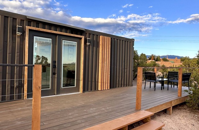Welcome to our modern and cozy sun-kissed shipping container retreat!