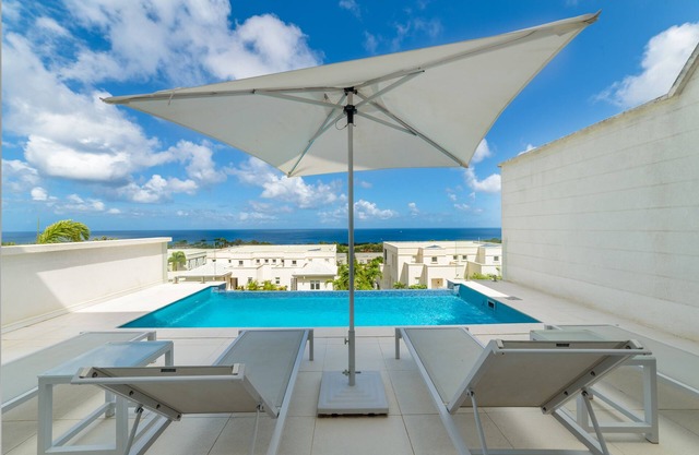White 4 bedroom villa with amazing ocean views in a gated community in St James