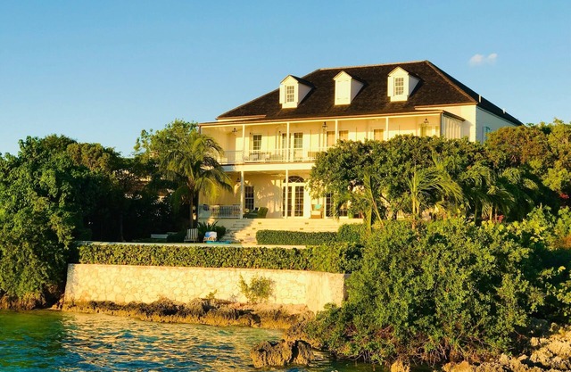 Wind Whistle Harbour Villa- a classic Bahamian 2.5 story veranda-style house.