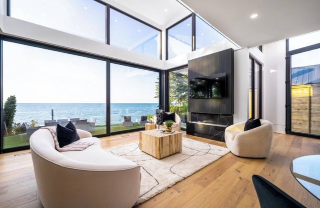Wine, Water and a rooftop pool. This dream waterfront home has it all..