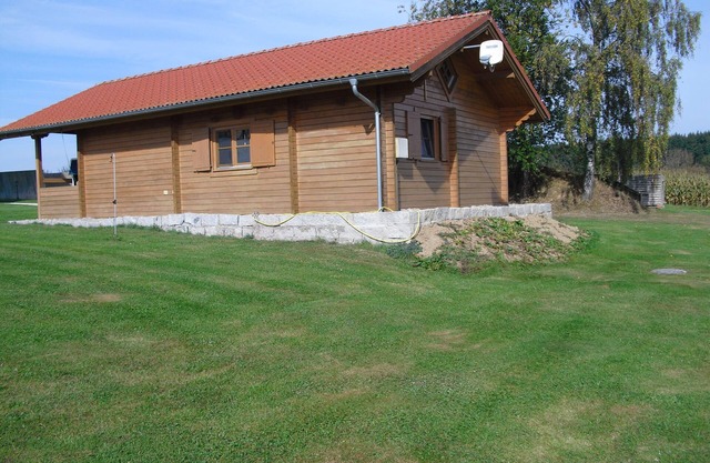 Wooden house with pool and sauna