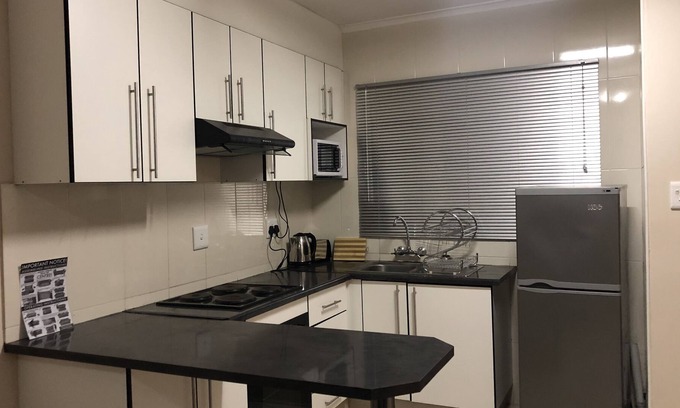 Manzini Apartment | 1 bedroom apartment, sleeps 4, 1 queen bed and double sleeper couch, bathtub