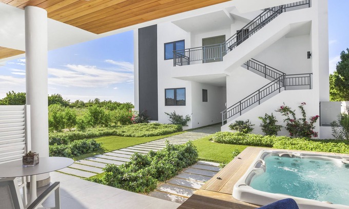 West End Village Condo | 1-BEDROOM + KITCHEN, HOT TUB AT TOP-RATED TRANQUILITY BEACH ON MEADS BAY BEACH