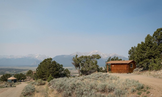 Buena Vista Cabin | 1 Room Dry Camping Cabin. Sleeps up to 4 in one queen bed and a set of twin bunks (bunk bed linens provided upon request).
