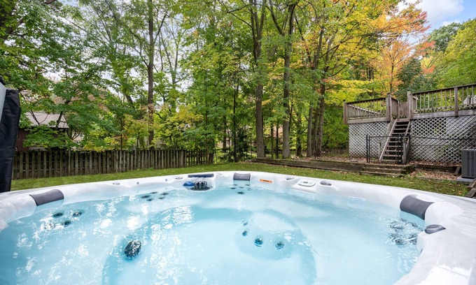 Wyoming House | 10 minutes from GR. High end retro retreat with hot tub, bar, and board games.