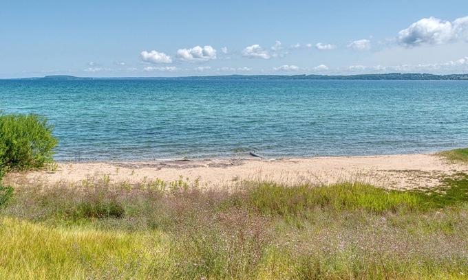 Greilickville House | 100 ft of private sandy beach on West Bay 3 miles from downtown TC. Lic#2022-53