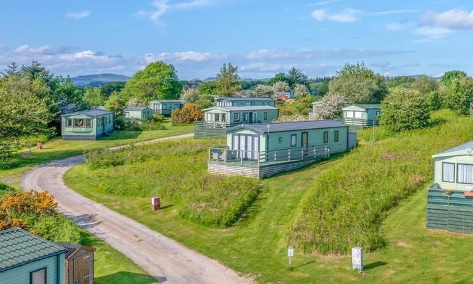 Castle Douglas House | 12ft-wide caravan situated in a coastal position.