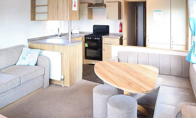 Chapel Saint Leonards House | 12ft-wide stylish and comfortable caravan with one double and two twin.