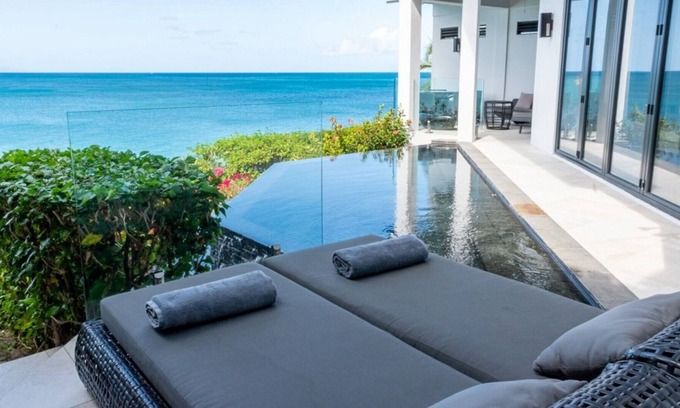 Fryes Beach Villa | 2 bedroom modern villa with stunning views overlooking the beach in Tamarind Hills