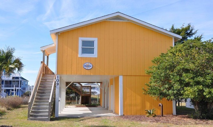 Holden Beach House | 2 bedrooms, 1 bathroom. Pet friendly with a fenced in back yard. Located on canal with dock the perfect place for fishing, crabbing, or docking your boat.
