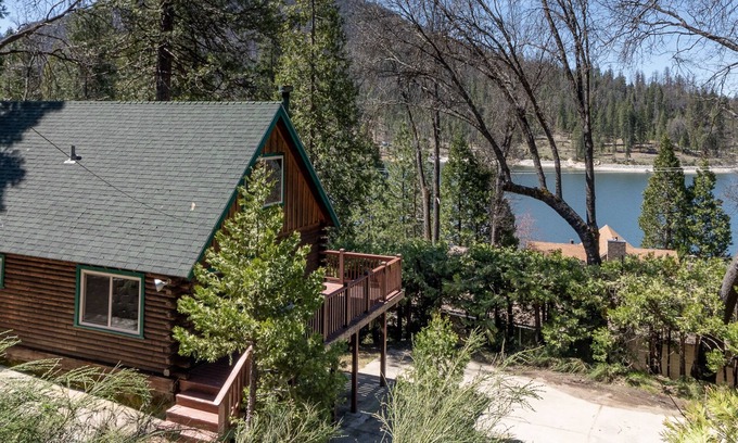 Bass Lake Cabin | 2 BR log cabin with lake view, wrap-around deck, Ping-Pong & wood stove