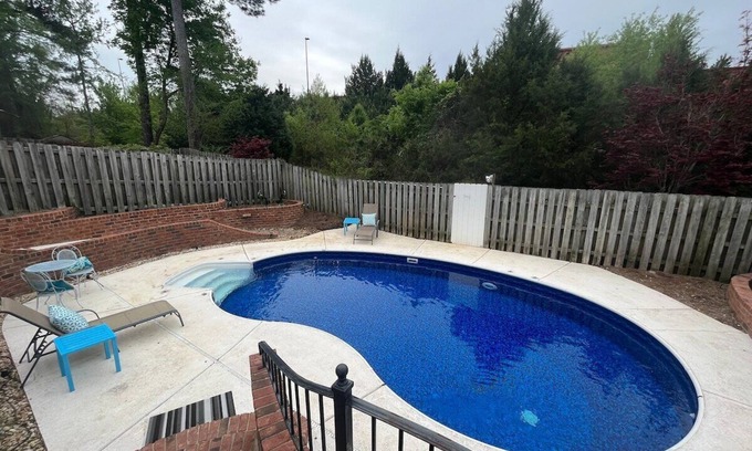 National Hills House | 3 bedroom, 2.5 bathroom patio home with an inground pool. The sleeping arrangements at this property include three queen beds and a futon located in the second living room.