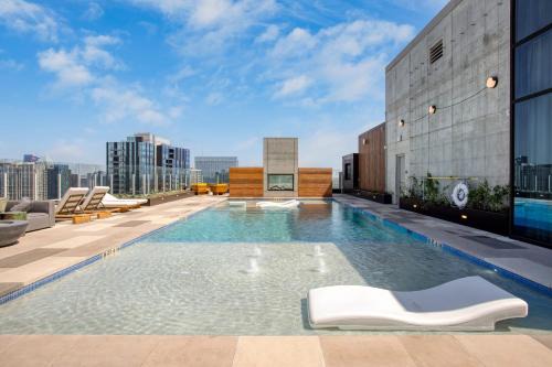 Rainey Street Historic District House | 3 Condos Brand New Austin High Rise w Rooftop Pool Gym Yoga Studio More