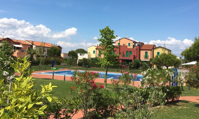 Aprilia Marittima Apartment | 3-room garden apartment. Lignano-Aprilia, air conditioning, pool, dog allowed,