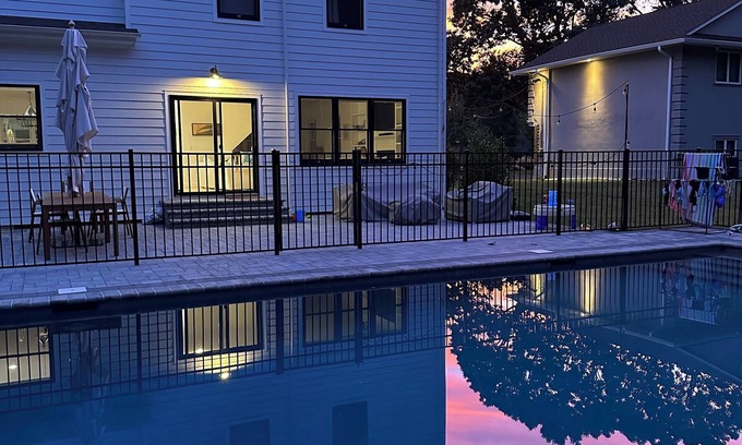 East Marion House | 4-bed 3.5-bath house with fenced heated pool and hot tub, fire pit, kids swings