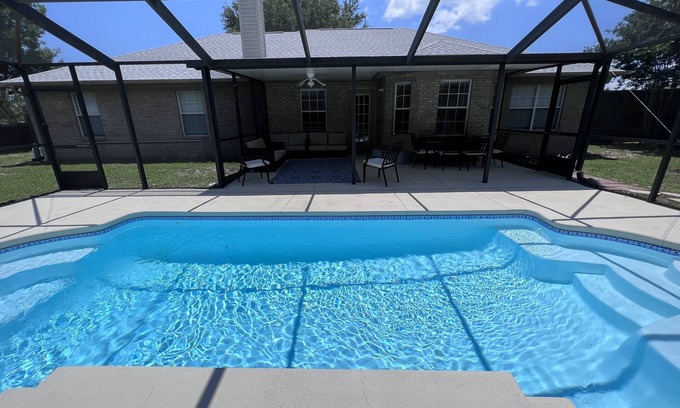 Navarre House | 4-bedroom oasis in Navarre with enclosed heated pool