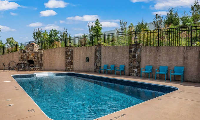 Sevierville Cabin | 4 King beds! Private, Heated Pool! Theater Room! Game Room! Bunks!