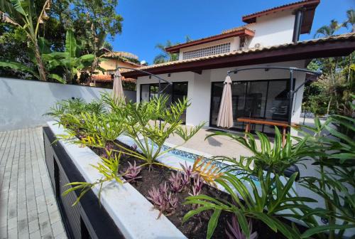 Costa do Sol House | 50m praia Cond pé na areia Alto padrao 4 suites Segur 24h Costa do sol Guaratuba Bertioga prox Riviera