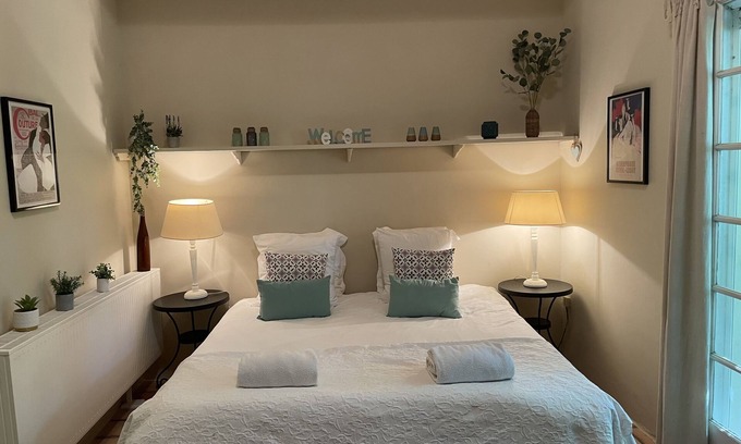 Villamblard Bed & Breakfast | A beautiful romantic bedroom with a mezzanine area, bathroom and private garden