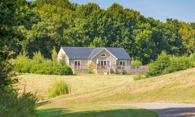 Pattiswick Cabin | A delightful lodge with hot tub on Wakes Hall Farm is a haven of peace in 500 acres of private land