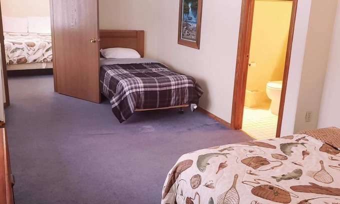 Ironwood Apartment | A fun fishing themed private guestroom for up to 5 inside the Lodge at North Ironwood Acres resort. TWO bathrooms! DOG FRIENDLY!.