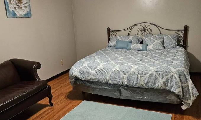 Petersburg House | A large room in Prince George County that has a King size bed and an ensuite.