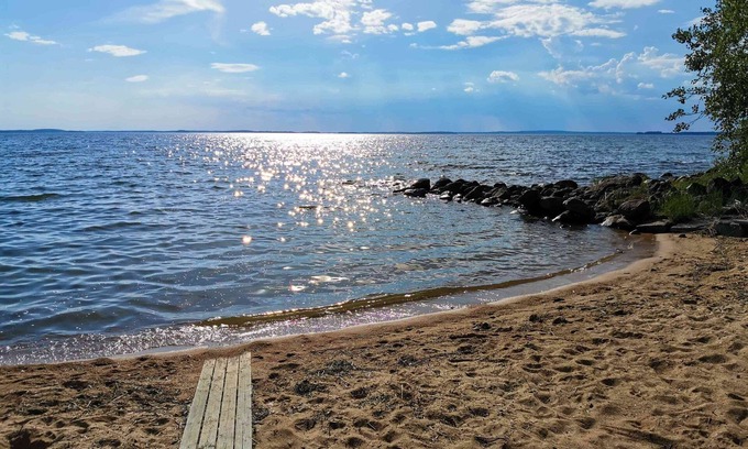 Kesaelahti Villa | A sunny, vintage villa with private sandy beach and breathtaking lake views