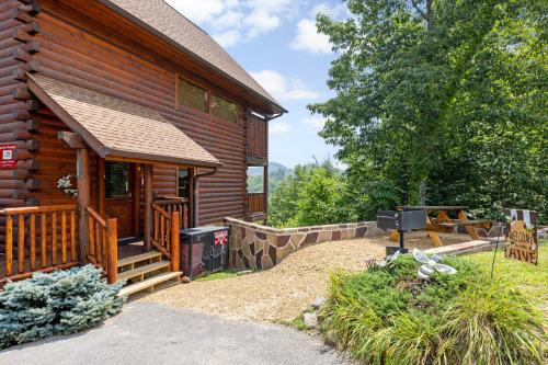 Gatlinburg - Pigeon Forge House | A Taste Of Honey is a dog-friendly two bedroom true log cabin nestled inside the Starr Crest resort