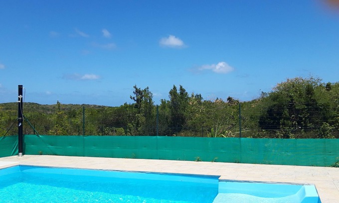 Le Moule House | Accommodation with swimming pool quiet location in greenery 5 minutes from amenities and beaches