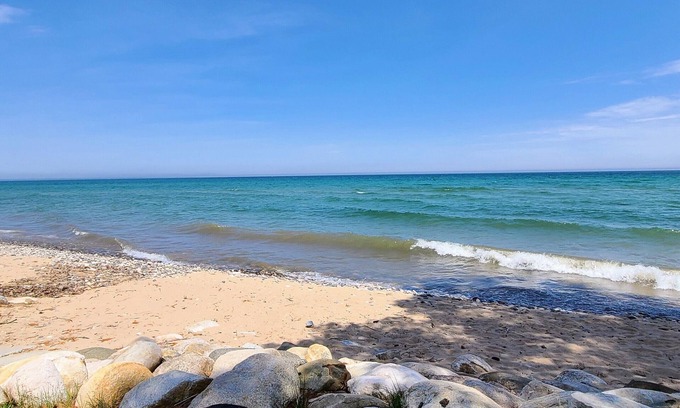 Cheboygan Cottage | Adorable Cottage - Lake Huron Access - Within the tall Northern Michigan trees!